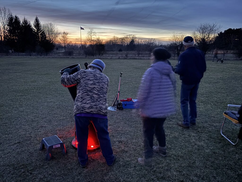 Maybury Star-Gazing event, Carrie making adjustments to her telescope